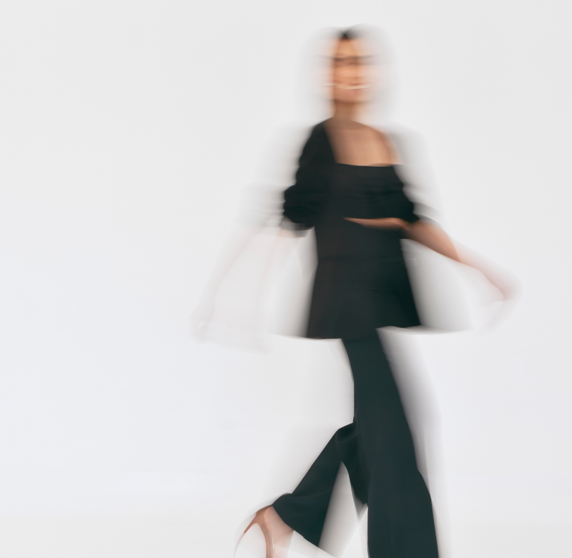 Blurry silhouette of a woman symbolizing impostor syndrome and breaking free with AI tools.