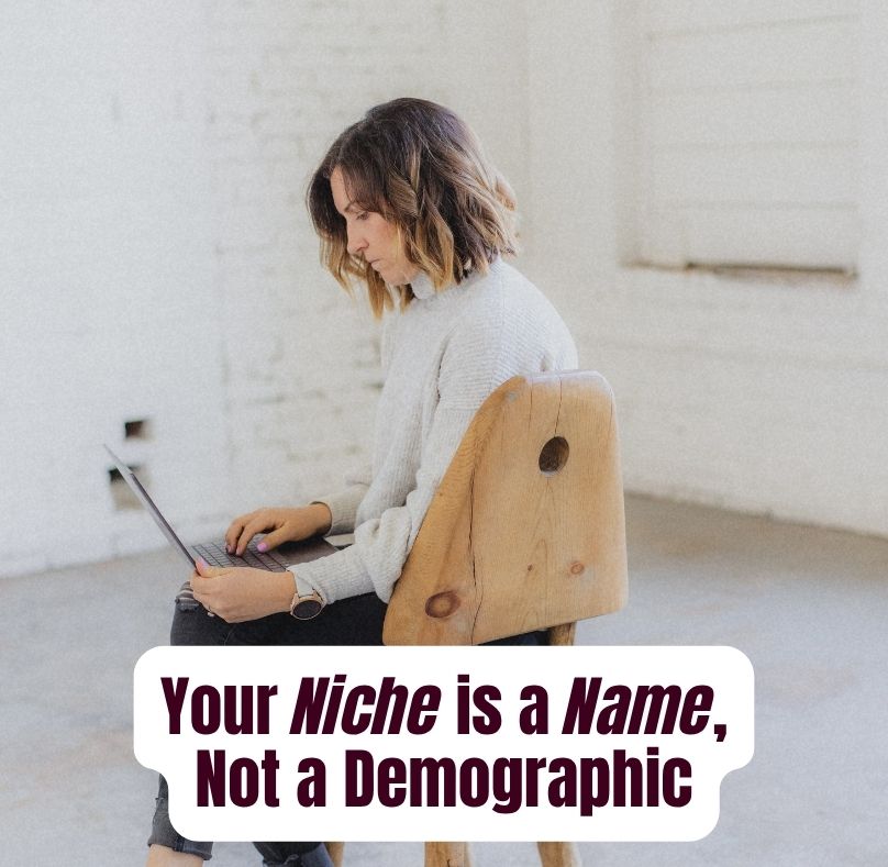 Bold text graphic reading "Your niche is a name, not a demographic" on a deep scarlet background, with "name" highlighted in burnt orange